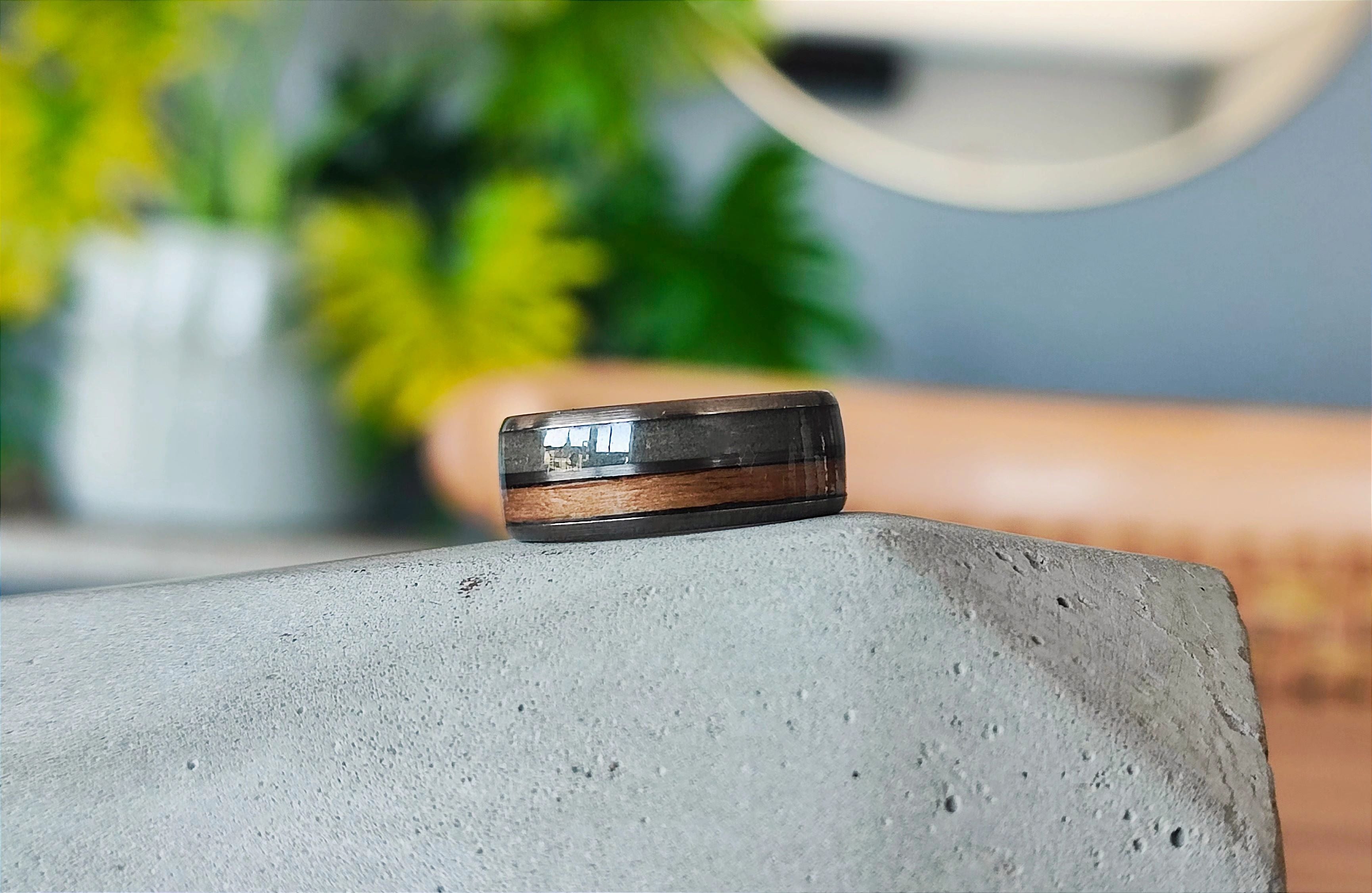 Tungsten wedding ring with cement & wood inlay.